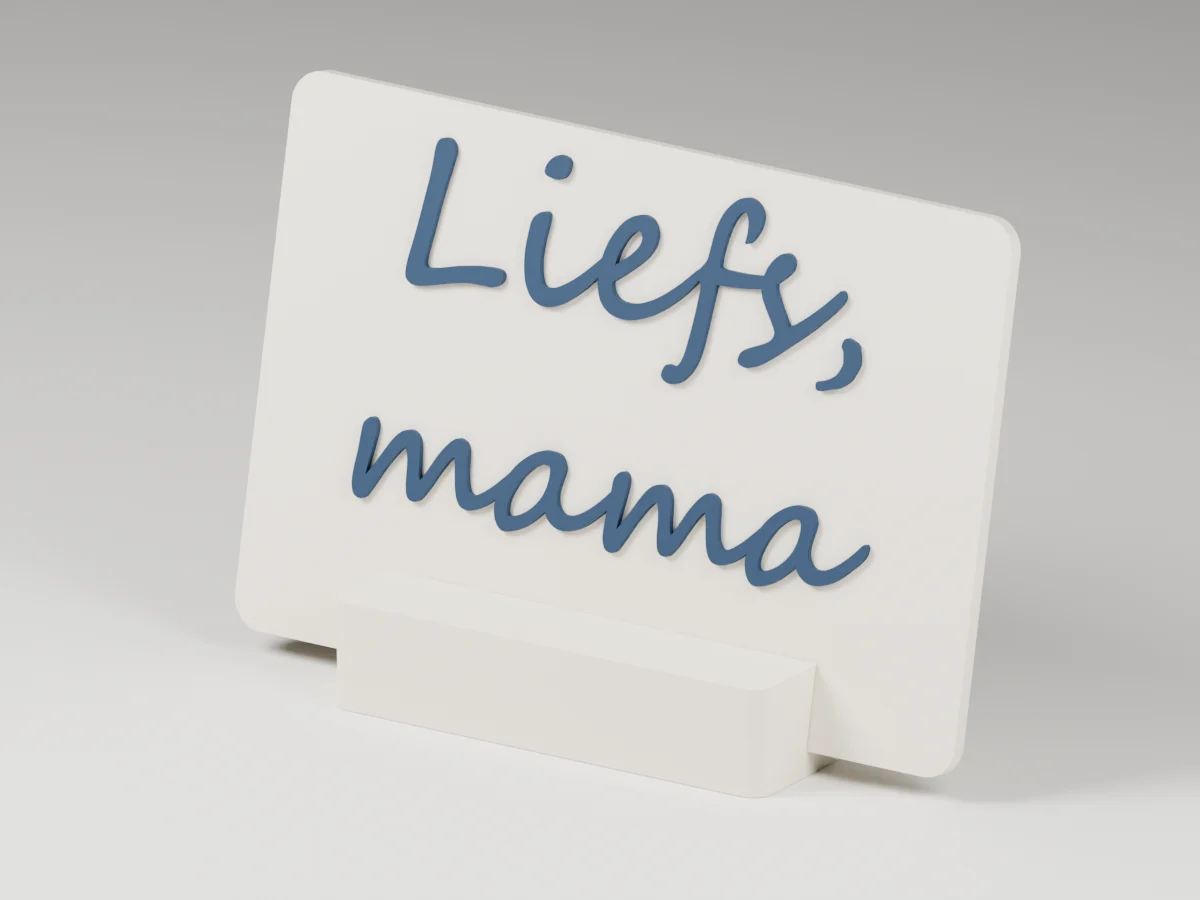 CAD-visualisatie van een ivoorkleurig tafelobject met verhoogde demonstratieletters Liefs, mama